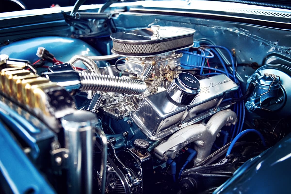 Close-up of a modern internal-combustion engine bay with routed wiring